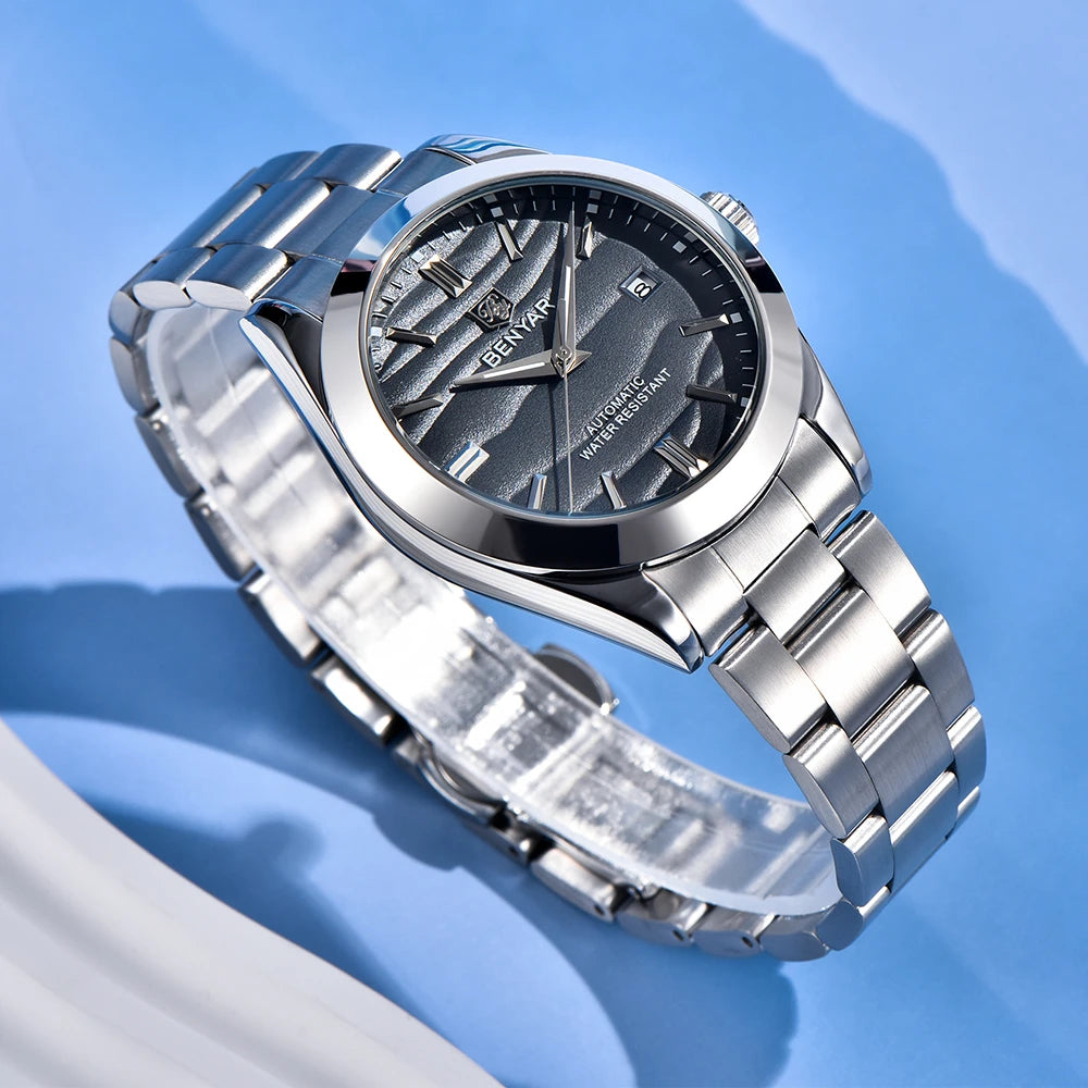 Close-up of black sand pattern dial with golden texture