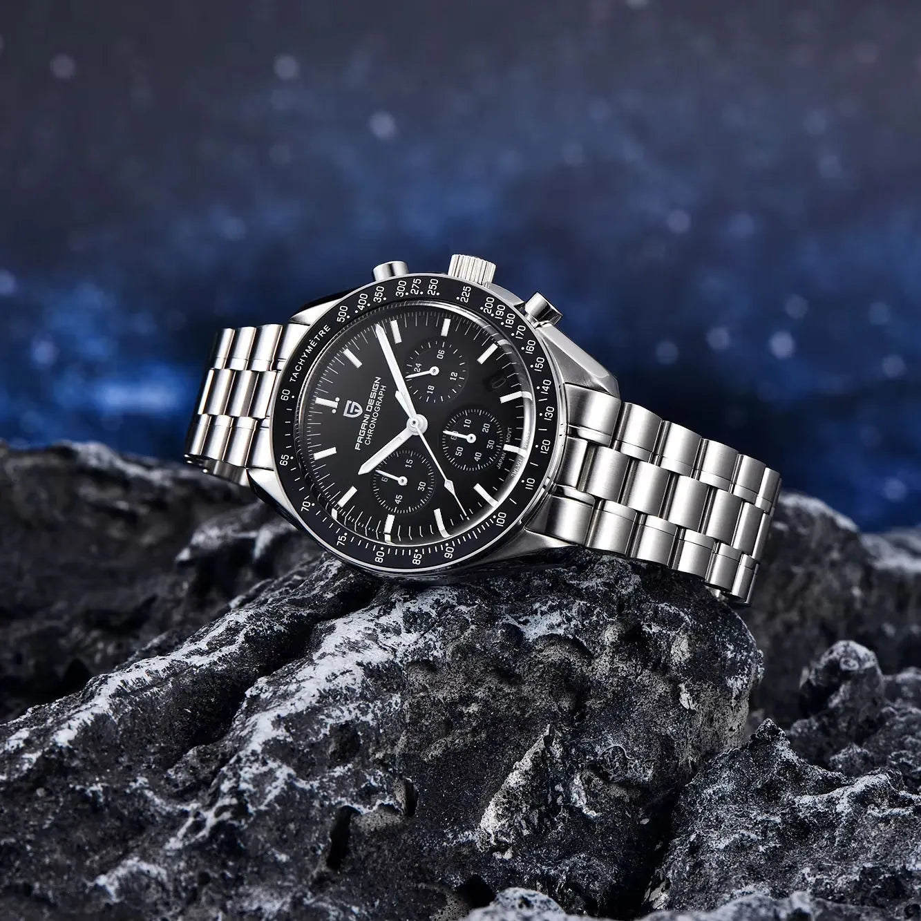 Pagani Design PD-1701 black dial chronograph watch with stainless steel bracelet placed on rock background luxury Speedmaster homage