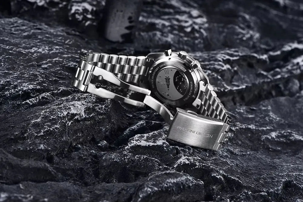 Pagani Design PD1701 stainless steel watch back view with bracelet clasp detail placed on dark textured rocks