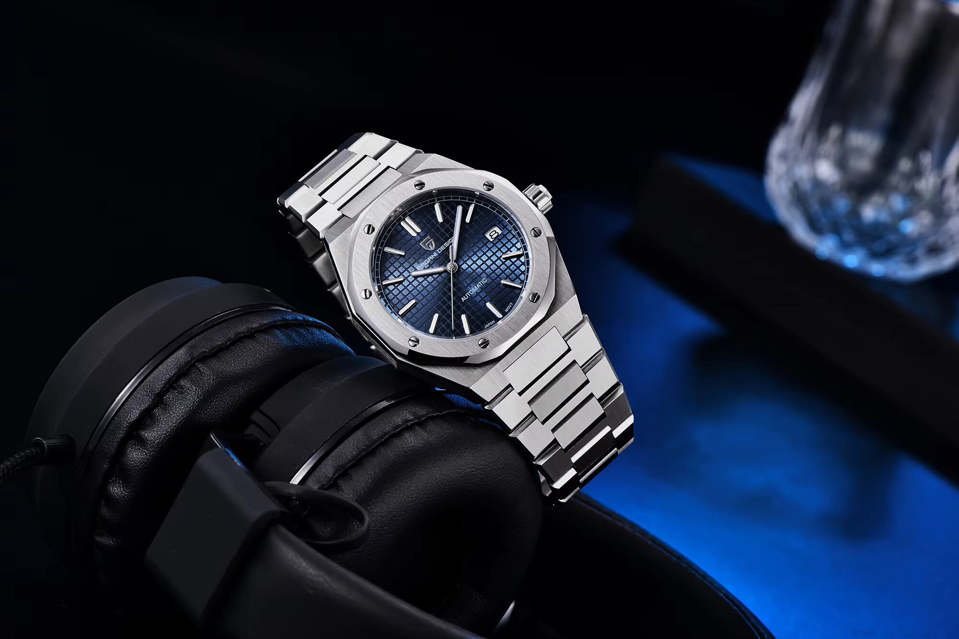  Close-up of blue dial and luminous markers on the Pagani Design Royal Oak homage automatic watch.