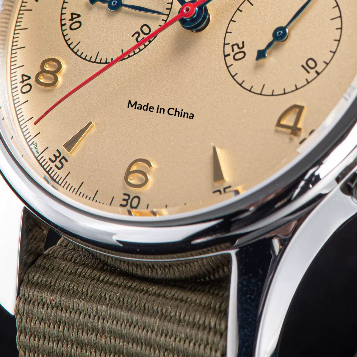 Macro close up of Seagull 1963 cream dial featuring r, blue hands, and vintage pilot chronograph details